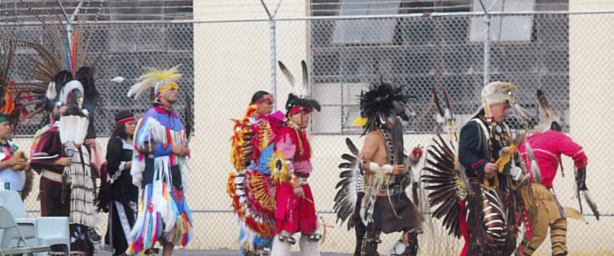 Lakota Club members, family, and spiritual leaders participate in a powwow inside the Oregon State Penitentiary