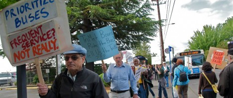 People protesting at a bus stop