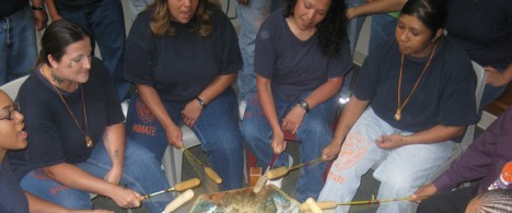 Women play a traditional Native American drum