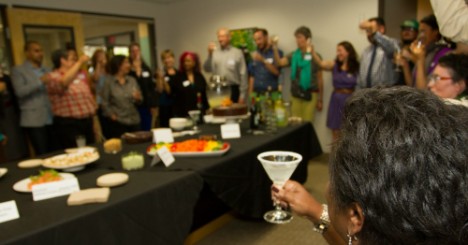 Everyone raises their glass at an MRG event