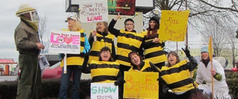 Action at Home Depot with people dressed as bees.