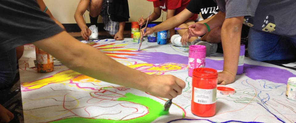 Youth create a mural with our partner Instituto In Xocitl In Cuicatl Art and Culture.