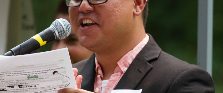 Colin Crader II speaking into a microphone