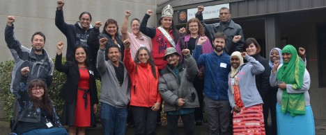 MRG activist led grantmakers celebrate a hard days work. All in a group with their hands raised.