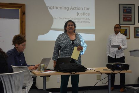 photo of three people at Strengthening Action for Justice meeting